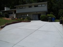 Driveway with brick wall